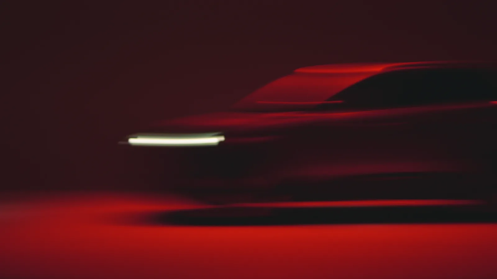 Perfil del Peugeot atravesando una estela de luz roja